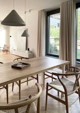 Dining Room, Pendant Lighting, Table, Chair, and Light Hardwood Floor The outdoor integrated in the design   Photo 12 of 12 in C59 by HAA&D