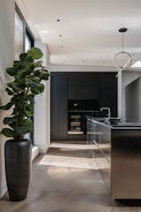 Kitchen, Light Hardwood Floor, Cooktops, Dishwasher, Wood Cabinet, Wine Cooler, Metal Counter, Ceiling Lighting, Refrigerator, Drop In Sink, Pendant Lighting, and Wall Oven The kitchen   Photo 10 of 15 in S_04 by HAA&D