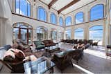 Living Room and Marble Floor Bright two-story great room area overlooking the sea.  Photo 10 of 19 in European Style Mansion Near Oldest Operational Lighthouse in Florida by TC McClenning