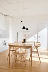 Dining Room, Table, Pendant Lighting, Light Hardwood Floor, Chair, Storage, and Shelves Kitchen and dining room  Photo 5 of 5 in L32 by HAA&D