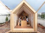 The design, which Juan and Tapia are selling for $7,950, has plumbing and electricity that can be used off-grid. Its rear module has a bookshelf, sink, an area for a coffee machine, and also two tables and chairs that nest to collapse the structure or just save on room while it’s open. The default furnishings can be adjusted to include elements like a fold-out bed or couch, more counter space, or additional shelving.
