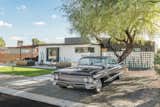 Exterior, Flat RoofLine, Wood Siding Material, Shed RoofLine, Concrete Siding Material, and Mid-Century Building Type front - with 61 Cadillac Deville in secondary parking spot  Photo 6 of 27 in 8023 Project