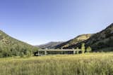 The house serves as a barrier to the visitor while privatizing the vast meadow behind.   Photo 6 of 22 in Snowmass Creek by Studio B Architecture + Interiors