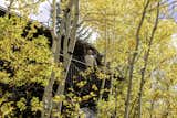 A cantilevered and hidden rear terrace offers solitude within the aspen canopy and is ideal for outdoor dining and views to Independence Pass and Aspen Mountain.
