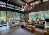 A  great room anchors the home, framing stunning river views while seamlessly blending interior and exterior spaces.