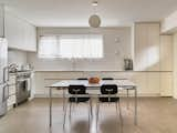 Kitchen, Glass Tile Backsplashe, Drop In Sink, Ceiling Lighting, White Cabinet, Concrete Floor, and Wall Lighting  Photo 13 of 17 in Osborne Laneway Suite by Lanescape Architecture Inc.