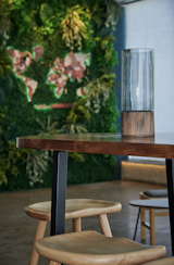 Dining Room, Accent Lighting, Chair, Concrete Floor, Stools, and Table A closeup to natural stained elements   Photo 4 of 8 in Autea by Cristiana Crin