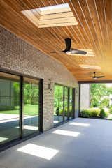 Marvin brand sliding doors open from the great room and primary bedroom to an expansive covered porch 