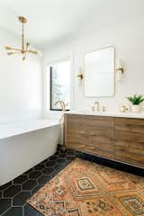 Ensuite freestanding tub and walnut cabinet 