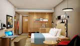 Bedroom, Wardrobe, Night Stands, Bed, Chair, Wall Lighting, Shelves, Ceiling Lighting, Floor Lighting, Table Lighting, and Medium Hardwood Floor Studio B Architects  Photo 1 of 4 in The Intersection of Technology and Smart Solutions for Modern Spaces by Studiob Architects