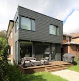 Exterior, Concrete Siding Material, Flat RoofLine, and House Building Type View at Corner II  Photo 4 of 5 in House Addition in Dufferin Grove by Leo Mieles