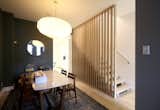 The dining area is located in the existing house, with a wall separating it and the kitchen.  Photo 7 of 16 in Addition and Renovation in Cabbagetown by Leo Mieles