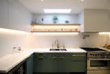 The skylight above the sink brings natural light deep into the floor plan. 