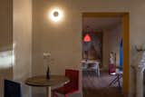 Dining Room, Medium Hardwood Floor, Lamps, Wall Lighting, Table, Chair, and Ceiling Lighting  Photo 6 of 13 in Verde Sazón Restaurant by Estudio Well
