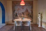Dining Room, Ceiling Lighting, Table, Medium Hardwood Floor, Lamps, and Chair  Photo 7 of 13 in Verde Sazón Restaurant by Estudio Well