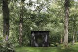 The Writer’s Block Hut is a tiny, timber-clad retreat designed to comfortably sleep one.