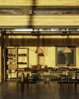 The wood’s light color keeps the spaces from feeling dark.