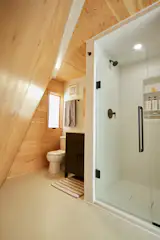 The Polyhaus bathroom comes with toilet, vanity, and full-size shower.