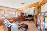 Living Room, Sofa, Desk, Bookcase, End Tables, Ottomans, Pendant Lighting, Lamps, Ceiling Lighting, and Ceramic Tile Floor  Photo 6 of 16 in Caligula Garden Estate by Kim Kelley