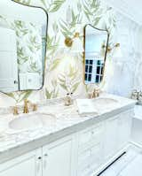 Bath Room, Marble Counter, Drop In Sink, Freestanding Tub, Stone Tile Wall, Wall Lighting, and Marble Floor Guest bathroom  Photo 2 of 7 in Alhambra House by Vanessa Certain