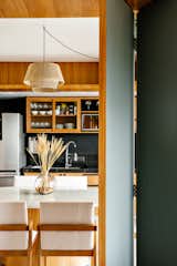 Compact apartment with open-plan spaces and strategic use of custom-made carpentry.
