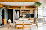 Compact apartment with open-plan spaces and strategic use of custom-made carpentry.