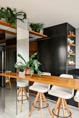 Compact apartment with open-plan spaces and strategic use of custom-made carpentry.