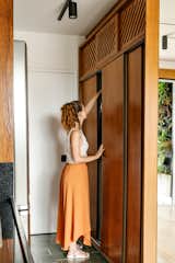 The Mirror in This Tiny Brazil Apartment Hides an Entire Work-From-Home Setup - Photo 10 of 12 - 
