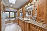 Bath Room, Pedestal Sink, Granite Counter, One Piece Toilet, Ceramic Tile Floor, Open Shower, Whirlpool Tub, Mosaic Tile Wall, Accent Lighting, and Ceiling Lighting  Photo 8 of 12 in Riverfront Home in Historic St. Charles by Christopher Wallace