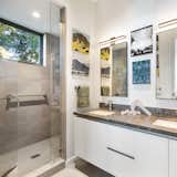 Bath Room, Quartzite Counter, Porcelain Tile Floor, Undermount Sink, One Piece Toilet, Porcelain Tile Wall, Enclosed Shower, Recessed Lighting, and Wall Lighting  Photo 9 of 10 in Earthquake-Resistant ADU by Studio PEEK | ANCONA