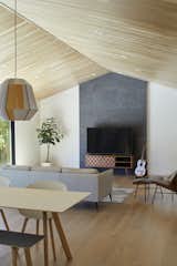 wooden high ceiling and accent stone tile exude understated elegance