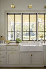 Kitchen, Undermount Sink, Wall Lighting, and Quartzite Counter  Photo 17 of 22 in Highway 96 Residence by Megan Glenn Architecture