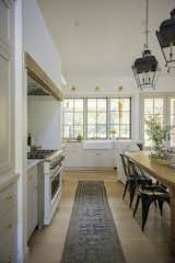 Kitchen, Medium Hardwood Floor, Rug Floor, Recessed Lighting, Quartzite Counter, Pendant Lighting, and Accent Lighting  Photo 11 of 22 in Highway 96 Residence by Megan Glenn Architecture