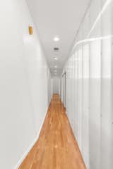 Hallway and Light Hardwood Floor  Photo 10 of 19 in The Pinstripe House by Margaret Mikkelsen