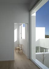 Doors, Folding Door Type, and Interior In the interior, transitional spaces have been avoided; the functional program is concatenated in a fluid way, the pieces of the program communicate in a direct way following Palladian principles but with a domestic scale.  Photo 12 of 14 in L'Alzina by Jaime Prous