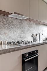 Kitchen countertop and kronos marble backsplash.