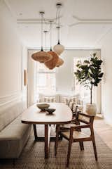 Dining Room, Chair, Bench, Wall Lighting, Ceiling Lighting, and Medium Hardwood Floor Diner table  Photo 6 of 23 in Vondelpark Residence by Flare Department