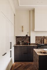 Kitchen, Cooktops, Recessed Lighting, Marble Counter, Wood Cabinet, Wall Lighting, Marble Backsplashe, and Medium Hardwood Floor Kitchen details  Photo 7 of 23 in Vondelpark Residence by Flare Department
