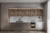 The kitchen features modern appliances and continues the theme with wooden furniture. 