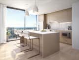 Kitchen, Pendant Lighting, Drop In Sink, Wood Cabinet, Refrigerator, Quartzite Counter, Recessed Lighting, Cooktops, and Microwave  Photo 1 of 11 in The Laurel Luxury Rentals Introduce Resort-Style Amenities and Design to West Palm Beach by Sadie Bryant
