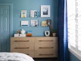 Bedroom, Night Stands, Bookcase, Bed, Light Hardwood Floor, Dresser, Shelves, and Ceiling Lighting Blue Skate Themed Boys Room  Photo 7 of 7 in Lake Life Project by MEGAN GRIBBLE HOME