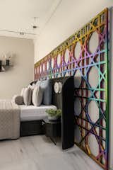 We used Grand Wicker pattern grill finished in Iridescence coating and a huge black curved headboard finished in suede for Sons Room, with edgy arched wall shelves and study finished in Ebony wood. Wardrobes were finished in ebony veneer and black mirror.