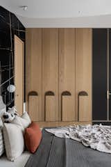 Daughters room was cladded with Saint Laurent and white Victorian tile ,wardrobe  was finished in veneer with jazz metallic handle , organic mirror  and dresser complemented the ceiling which we used to cover the beam right on the centre on the bed.