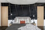 Daughters room was cladded with Saint Laurent and white Victorian tile ,wardrobe  was finished in veneer with jazz metallic handle , organic mirror  and dresser complemented the ceiling which we used to cover the beam right on the centre on the bed.