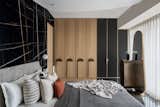 Daughters room was cladded with Saint Laurent and white Victorian tile ,wardrobe  was finished in veneer with jazz metallic handle , organic mirror  and dresser complemented the ceiling which we used to cover the beam right on the centre on the bed.