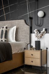 Daughters room was cladded with Saint Laurent and white Victorian tile ,wardrobe  was finished in veneer with jazz metallic handle , organic mirror  and dresser complemented the ceiling which we used to cover the beam right on the centre on the bed.