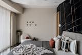 Daughters room was cladded with Saint Laurent and white Victorian tile ,wardrobe  was finished in veneer with jazz metallic handle , organic mirror  and dresser complemented the ceiling which we used to cover the beam right on the centre on the bed.