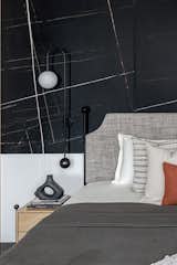 Daughters room was cladded with Saint Laurent and white Victorian tile ,wardrobe  was finished in veneer with jazz metallic handle , organic mirror  and dresser complemented the ceiling which we used to cover the beam right on the centre on the bed.