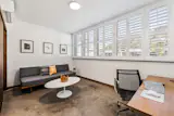 Guest bedroom/office with a view of Diamond Head Crater on the other side of plantation shutters