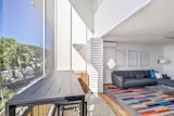 Living Room opens to the Lanai, which has two-story high ceilings and a beautiful view of Kapiolani Park and the Diamond Head side of Waikiki